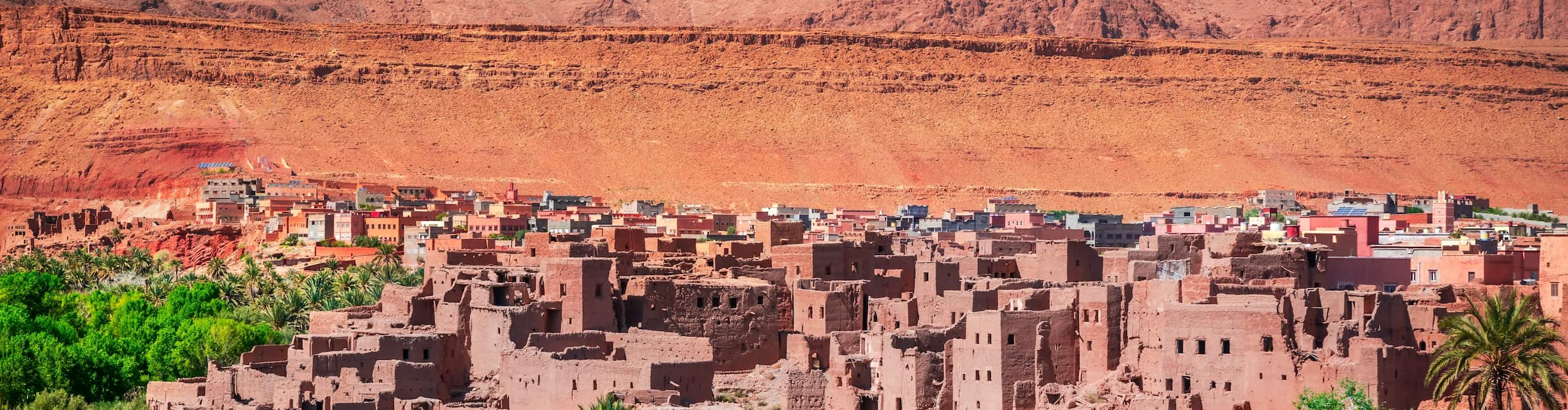 Traditional Japanese houses and autumnal leaves with Mount Fuji in the background
