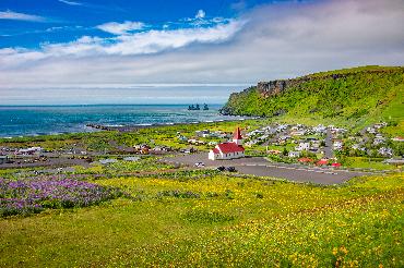 Panoramic view of Vik, South Iceland, on a summer sunny day with blue skies