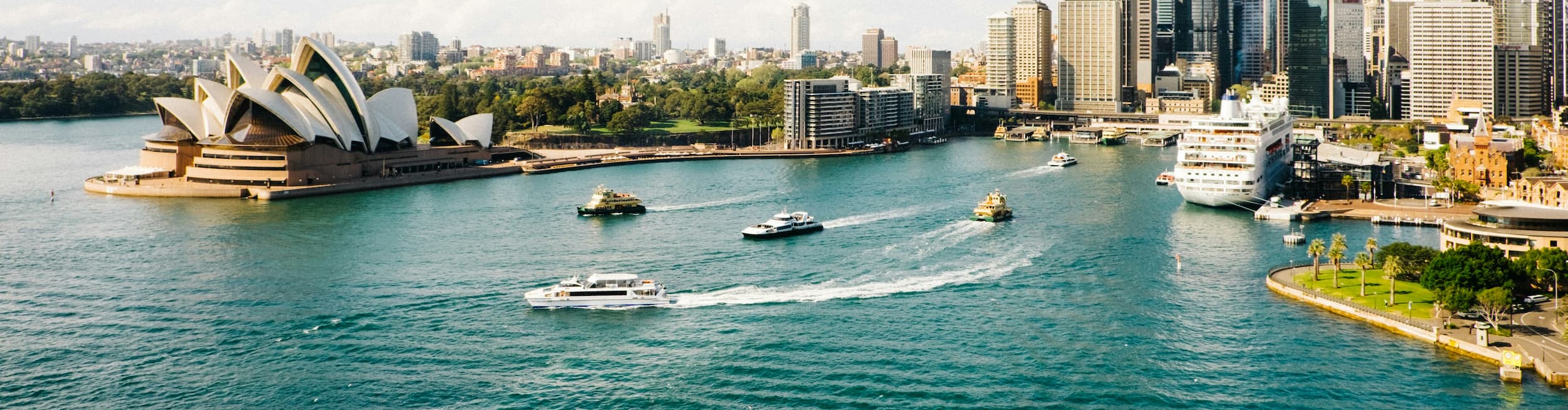 Drone view of the Sydney port backed by the city skyline in Australia
