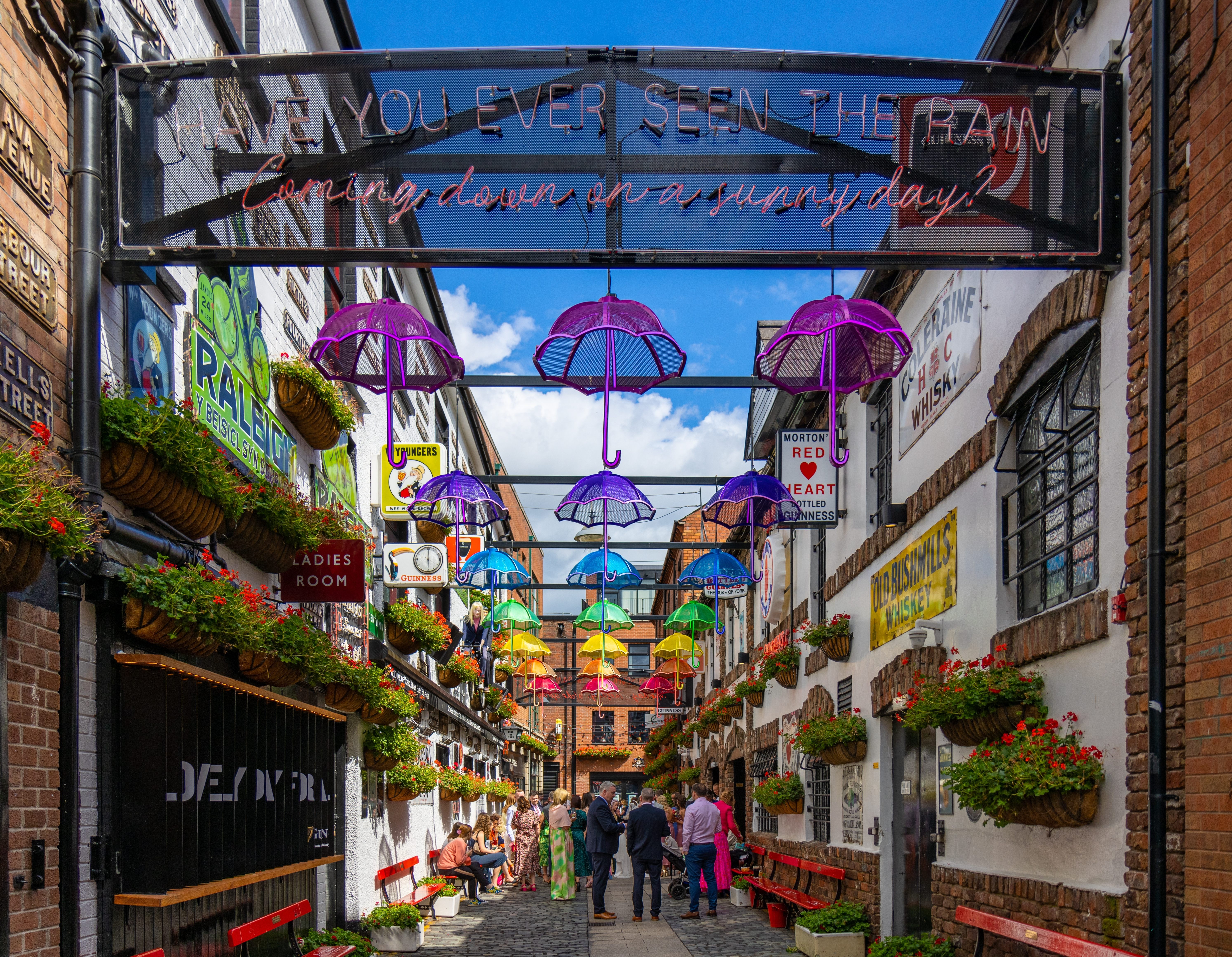 Commercial Court, Cathedral Quarter, historic pubs like Duke of York and The Dark Horse, and a set of beautiful murals and decorated umbrellas in Belfast, Ireland