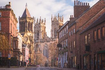 Morning golden light on the historic old town of York along Museum St.