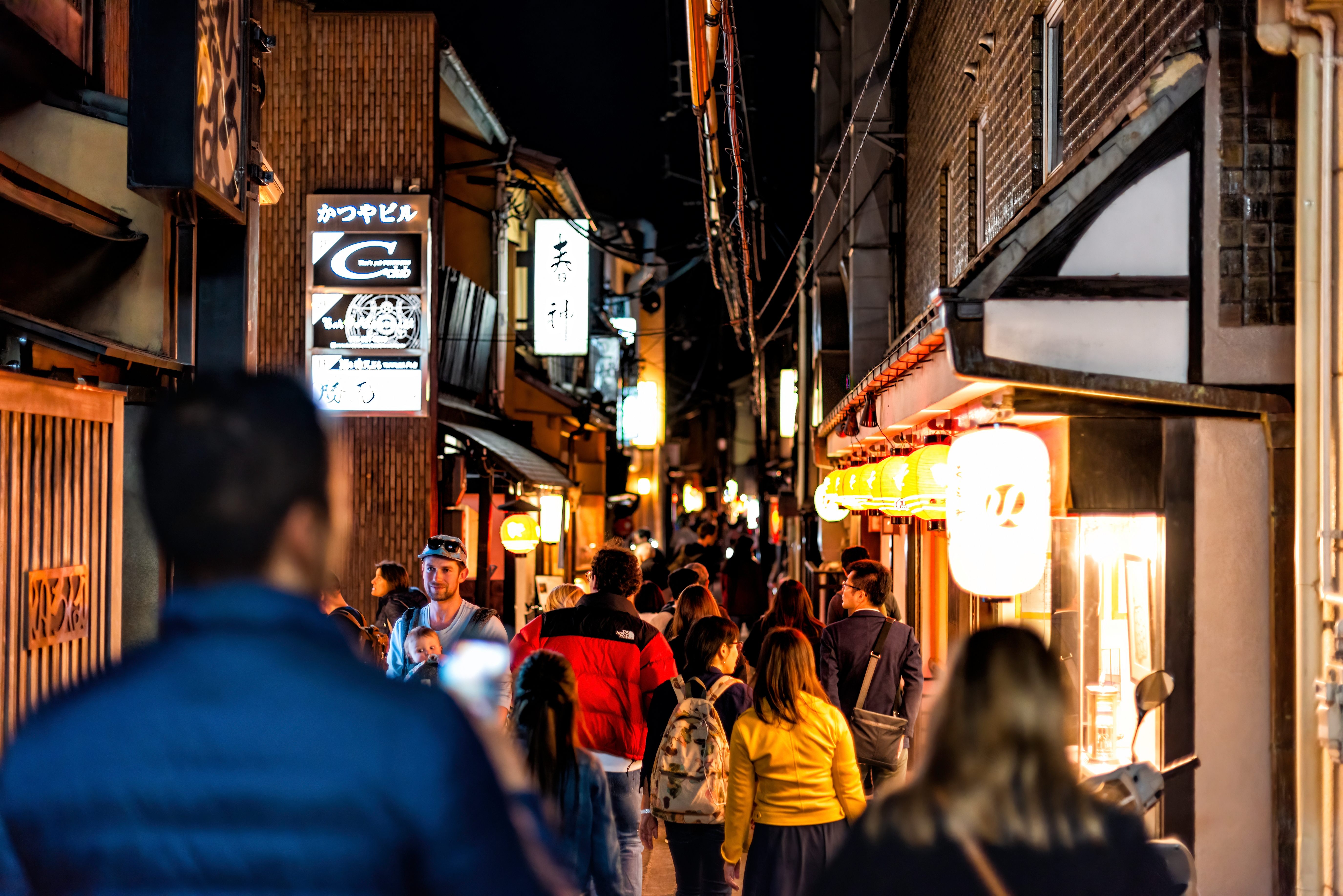 People walking down Pontocho Alley at night, Kyoto