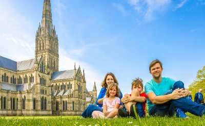 Family at Salisbury cathedral in sunny day